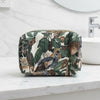 Washbag with a tropical leaf pattern on a neutral background